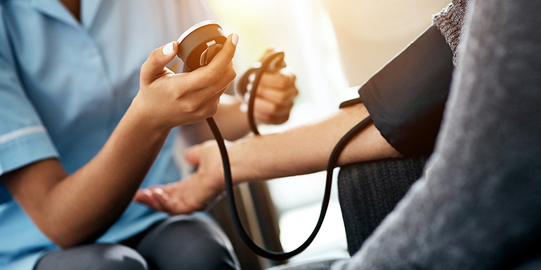 Medical Professional Performing a Blood Pressure Test