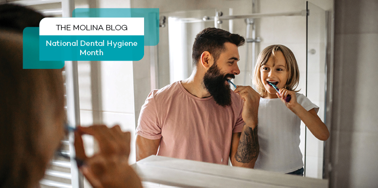 father and daughter brushing teeth